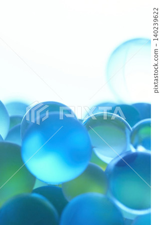 Macro background of colorful glass spheres in water Macro background of colorful glass spheres in water 140239622