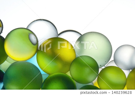 Macro background of colorful glass spheres in water Macro background of colorful glass spheres in water 140239628