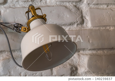Modern Industrial Wall Lamp on White Painted Brick Wall 140239837