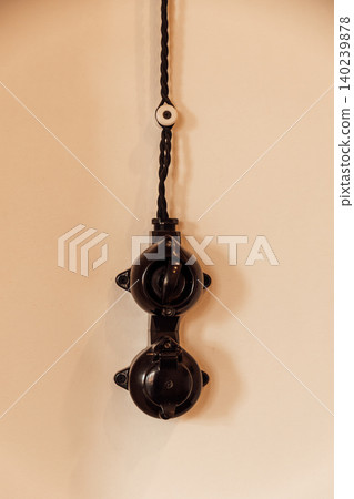 Vintage Bakelite Electrical Switch and Power Outlet on Wall Vintage Bakelite Electrical Switch and Power Outlet on Wall 140239878
