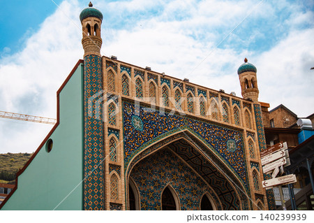 Ornate Islamic Architecture with Colorful Mosaic Tiles and Decorative Minaret Towers Ornate Islamic Architecture with Colorful Mosaic Tiles and Decorative Minaret Towers 140239939
