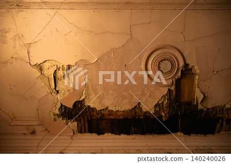 Decaying Historic Interior Wall with Cracked Plaster and Exposed Wooden Structure Decaying Historic Interior Wall with Cracked Plaster and Exposed Wooden Structure 140240026