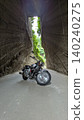 Motorcycle in the tunnel 140240275