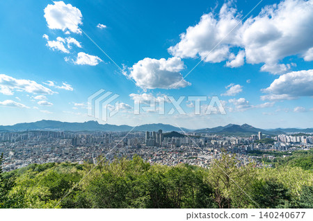 Panoramic view of downtown Seoul city skyline from Yongmasan mountain observatory on a clear spring afternoon Panoramic view of downtown Seoul city skyline from Yongmasan mountain observatory on a clear spring afternoon 140240677