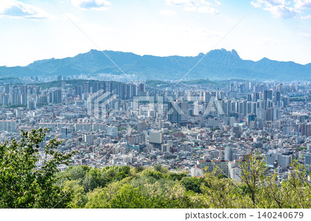 Panoramic view of downtown Seoul city skyline from Yongmasan mountain observatory on a clear spring afternoon Panoramic view of downtown Seoul city skyline from Yongmasan mountain observatory on a clear spring afternoon 140240679