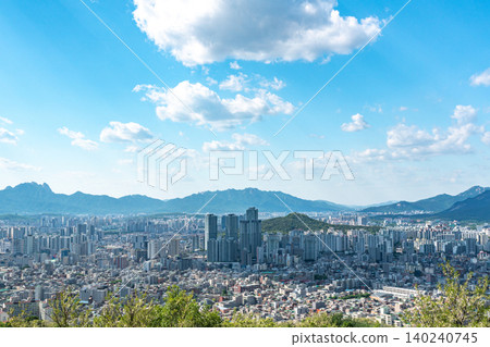 Panoramic view of downtown Seoul city skyline from Yongmasan mountain observatory on a clear spring afternoon Panoramic view of downtown Seoul city skyline from Yongmasan mountain observatory on a clear spring afternoon 140240745