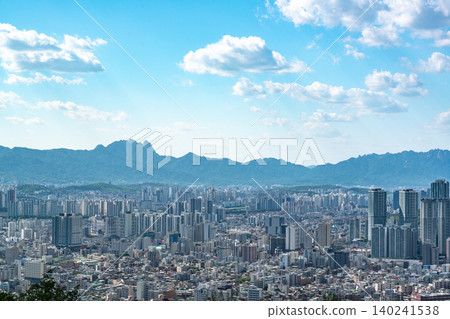 Panoramic view of downtown Seoul city skyline from Yongmasan mountain observatory on a clear spring afternoon Panoramic view of downtown Seoul city skyline from Yongmasan mountain observatory on a clear spring afternoon 140241538