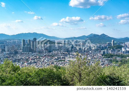 Panoramic view of downtown Seoul city skyline from Yongmasan mountain observatory on a clear spring afternoon Panoramic view of downtown Seoul city skyline from Yongmasan mountain observatory on a clear spring afternoon 140241539