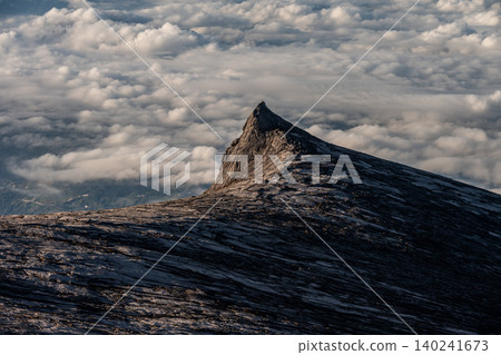 Spectacular view of an iconic peak named South Peak (3929 m) on Mt.Kinabalu, Malaysia. Mount Kinabalu is the tallest mountain in Malaysia and Borneo. Spectacular view of an iconic peak named South Peak (3929 m) on Mt.Kinabalu, Malaysia. Mount Kinabalu is the tallest mountain in Malaysia and Borneo. 140241673