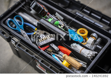Toolbox is disorganized and messy. Toolbox is disorganized and messy. 140241892