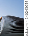 Futuristic curved architectural facade 140243056