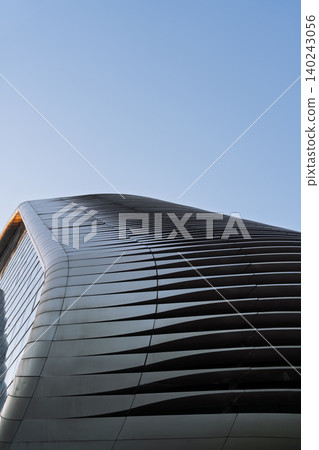 Futuristic curved architectural facade Futuristic curved architectural facade 140243056