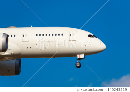 Image of a passenger plane flying through a blue sky Image of a passenger plane flying through a blue sky 140243219