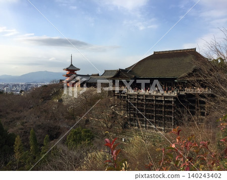 Kiyomizu-dera Temple on New Year's Eve: The stage and three-story pagoda standing in the winter-bare Kyoto landscape. Kiyomizu-dera Temple on New Year's Eve: The stage and three-story pagoda standing in the winter-bare Kyoto landscape. 140243402