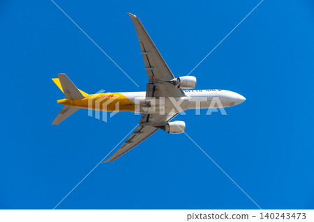 Image of a cargo plane flying through a blue sky - Polar Air Cargo Image of a cargo plane flying through a blue sky - Polar Air Cargo 140243473