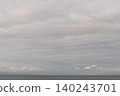 A dreamlike seascape bathed in the morning glow and soft pastel light. 140243701