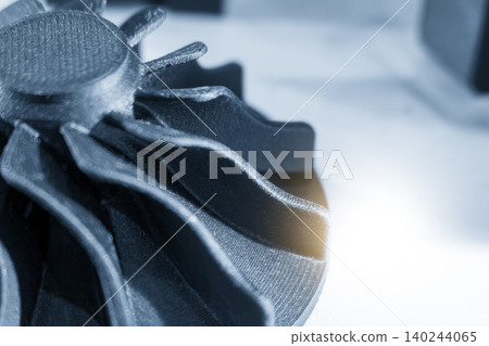 Close-up of functional sample parts created by advanced 3D printing method in a blue tone scene. Close-up of functional sample parts created by advanced 3D printing method in a blue tone scene. 140244065