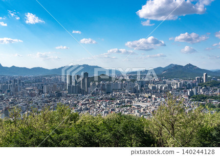 Panoramic view of downtown Seoul city skyline from Yongmasan mountain observatory on a clear spring afternoon Panoramic view of downtown Seoul city skyline from Yongmasan mountain observatory on a clear spring afternoon 140244128