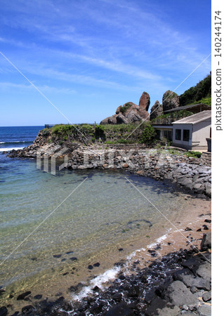 A view of the Minato no Tatekami Rock, a popular tourist spot in Karatsu City, Saga Prefecture, and the Genkai Sea, a popular surfing spot. A view of the Minato no Tatekami Rock, a popular tourist spot in Karatsu City, Saga Prefecture, and the Genkai Sea, a popular surfing spot. 140244174