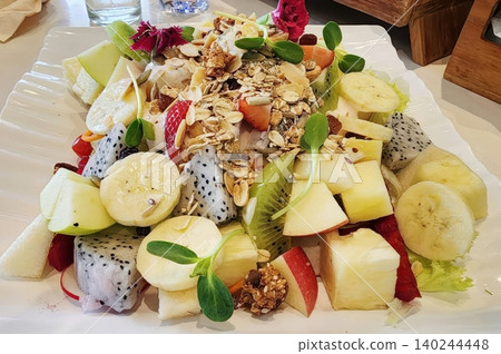 Healthy Mixed Fruit Salad with Granola Apple Kiwi and Dragon Fruit Healthy Mixed Fruit Salad with Granola Apple Kiwi and Dragon Fruit 140244448