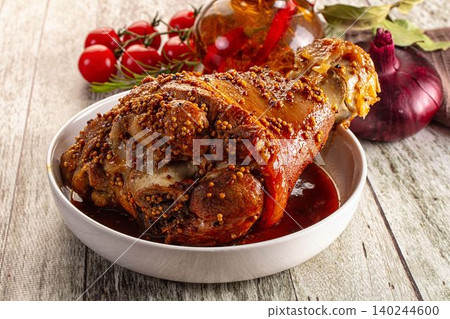Roasted pork knuckle with mustard seeds and vegetables Roasted pork knuckle with mustard seeds and vegetables 140244600