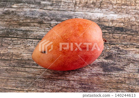 Ripe mango fruit on rustic wooden table Ripe mango fruit on rustic wooden table 140244613