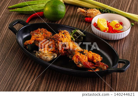 Grilled Frog Legs with Spices and Fresh Ingredients Grilled Frog Legs with Spices and Fresh Ingredients 140244621