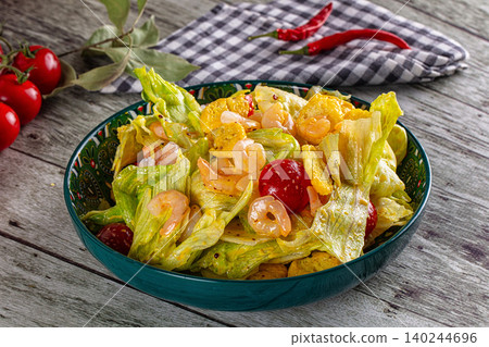 Fresh salad with shrimp and croutons in green bowl Fresh salad with shrimp and croutons in green bowl 140244696