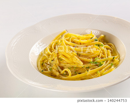 Lemon zest and pepper pasta in white bowl Lemon zest and pepper pasta in white bowl 140244753