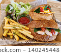 Lunch box containing a croissant sandwich 140245448