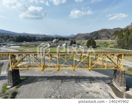 [Aerial view] Civil engineering heritage site - Ichinotogawa Bridge and the Iide Mountain Range (Fukushima Prefecture) 140245902