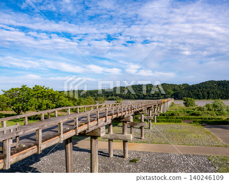 A wooden bridge (Horai Bridge) stands out against the blue sky. A wooden bridge (Horai Bridge) stands out against the blue sky. 140246109
