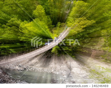The dream suspension bridge, beautifully framed by the fresh greenery, in Sumata Gorge The dream suspension bridge, beautifully framed by the fresh greenery, in Sumata Gorge 140246469