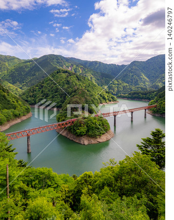 Oku-Oi Lake Station: A secluded station floating on the blue surface of a lake. Oku-Oi Lake Station: A secluded station floating on the blue surface of a lake. 140246797