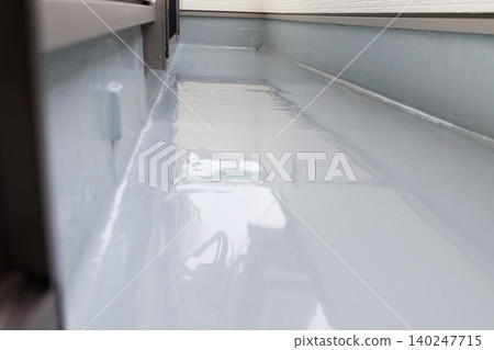 Balcony waterproofing work and renovation. Glossy flat surface with urethane coating. 140247715