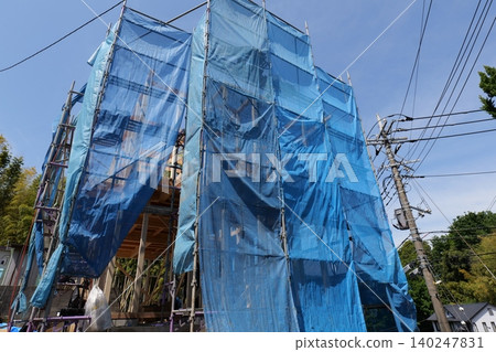 Japanese Construction Scaffolding with Safety Netting Japanese Construction Scaffolding with Safety Netting 140247831