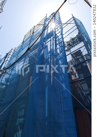 Japanese Construction Scaffolding with Safety Netting Japanese Construction Scaffolding with Safety Netting 140247832