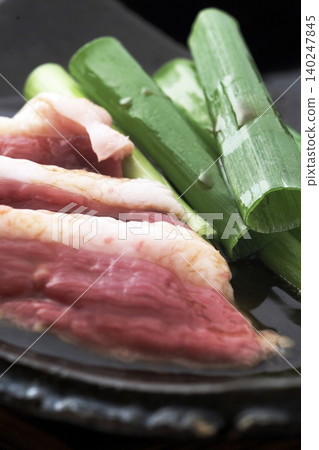 Thinly sliced duck meat and green onions Thinly sliced duck meat and green onions 140247845