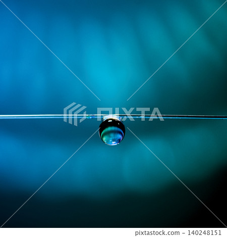 The sight of raindrops hanging in the darkness is mystical and beautiful. 140248151