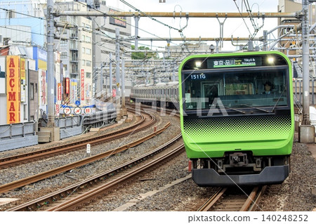 E235 series train running near Okachimachi Station on the Yamanote Line. E235 series train running near Okachimachi Station on the Yamanote Line. 140248252