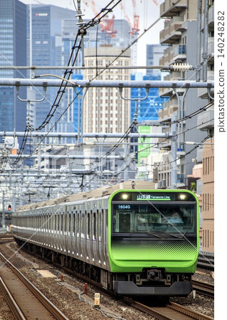 E235 series train running near Okachimachi Station on the Yamanote Line. E235 series train running near Okachimachi Station on the Yamanote Line. 140248282