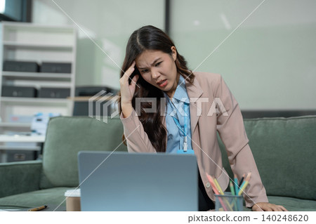 stressed businesswoman working in the office. Businessman thinking too much work concept in the office. stressed businesswoman working in the office. Businessman thinking too much work concept in the office. 140248620