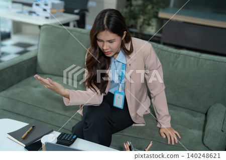 stressed businesswoman working in the office. Businessman thinking too much work concept in the office. stressed businesswoman working in the office. Businessman thinking too much work concept in the office. 140248621