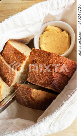 Artisan Bread Basket with Creamy Butter Served as Restaurant Appetizer Artisan Bread Basket with Creamy Butter Served as Restaurant Appetizer 140248720