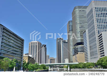 Osaka's skyline as seen from Nakanoshima Park Osaka's skyline as seen from Nakanoshima Park 140248770