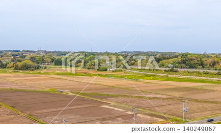 April 30 2026 Nangu Shin Rifu countryside with farmland powerlines and urban skyline April 30 2026 Nangu Shin Rifu countryside with farmland powerlines and urban skyline 140249067