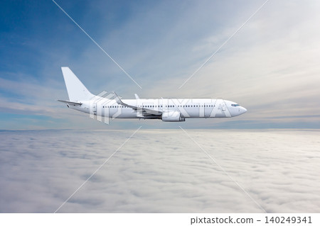White passenger plane flies in the air above the clouds White passenger plane flies in the air above the clouds 140249341