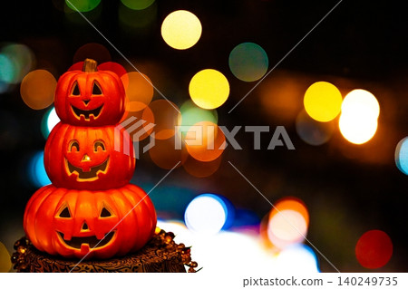 Halloween pumpkins against a night view background Halloween pumpkins against a night view background 140249735