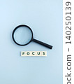Magnifying glass and focus word showing research and analysis 140250139