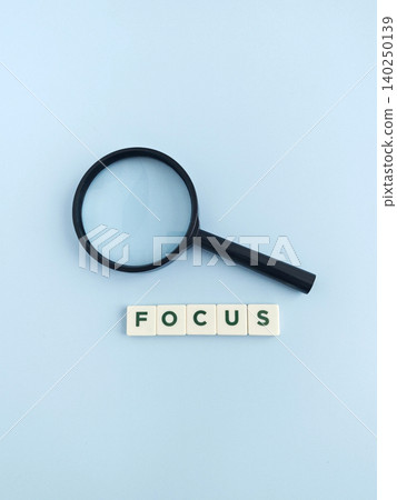 Magnifying glass and focus word showing research and analysis Magnifying glass and focus word showing research and analysis 140250139